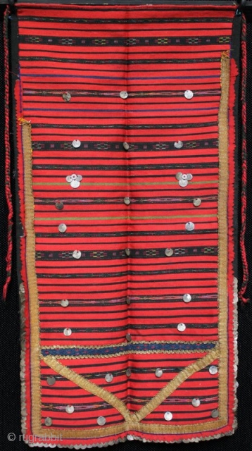 A late 19th century Bulgarian pristilka apron from the Vratsa region with over 160 Ottoman silver alloy coins stitched along the side and bottom edges and front. Very finely woven flat weave  ...