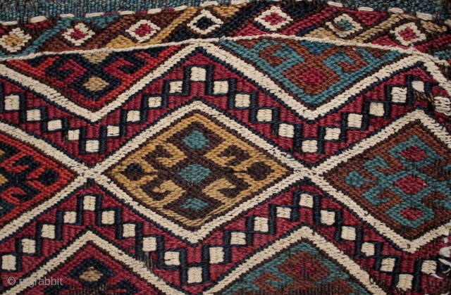 Antique Anatolian chuval from East Anatolia with intense natural dyes.

An unusual survivor, a 19th century East Anatolian chuval with beautiful natural dyes in original condition with old nomadic patch repairs and some  ...