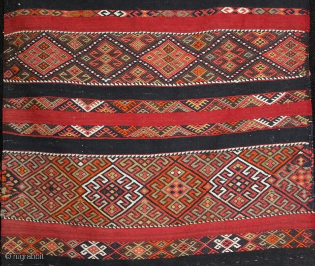 An old Anatolian long kilim runner, tightly woven flat weave with very fine çiçim and soumak embroidery, I estimate from the 1920s. Excellent drawing, good colours and in very good condition. 285x84cm

For  ...
