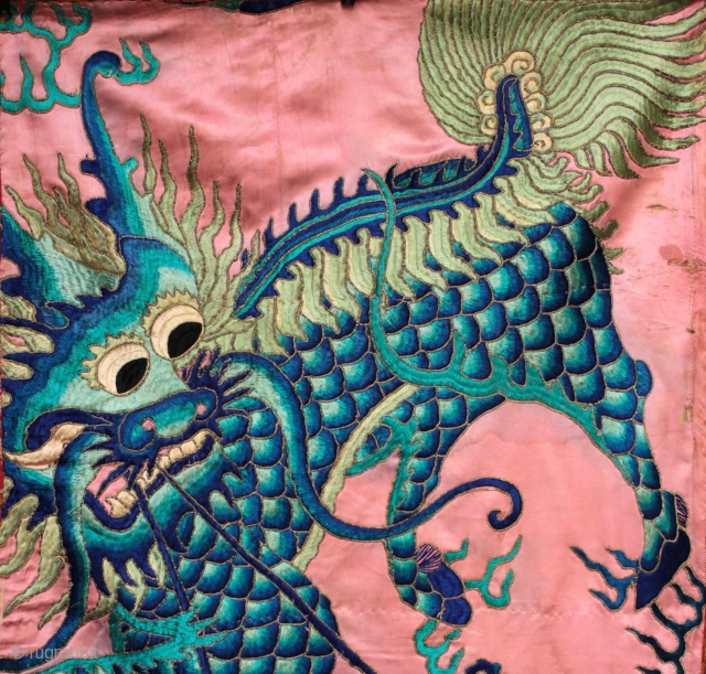 Antique Chinese silk embroidered panel of a Qilin.

Silk embroidery on fine silk fabric with gold bound metallic thread defining the drawing of the qilin, a treasure chest and guarding serpent. The embroidery  ...