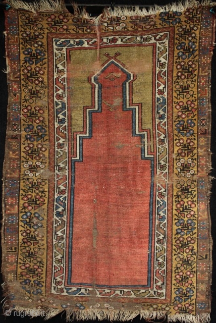 A 19th century (mid?) central Anatolian Muçur or Mujur prayer rug. A nice grass green above the mirhab prayer niche. In worn condition with loss to ends and foundation showing as seen  ...