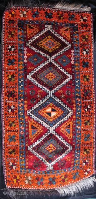 Beautiful old east Anatolian Kurdish rug from Yavuzeli near Gaziantep with harlequin pair of yastik cushions.

Hand spun lustrous wool on an alternating white and black goat hair warp, vibrant colours including a  ...