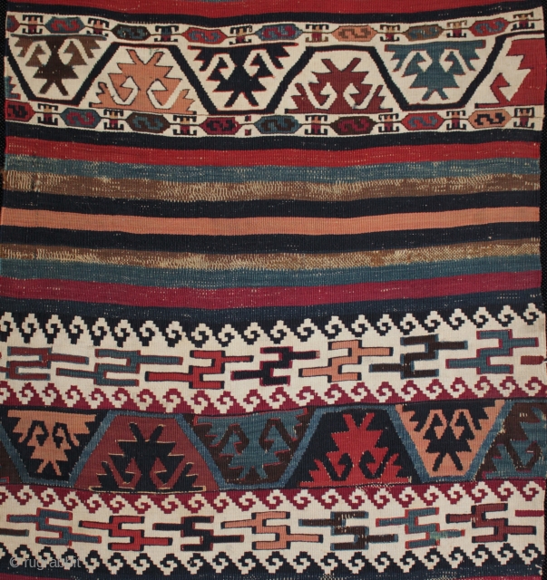 Mid 19th century east Anatolian killim from Reyhanli of unusual design.

Although some might identify the main motifs as elibelinde or hands on hips motifs, I wondered if in this kilim they might  ...