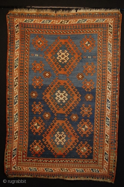 size 185x127 cm
age ca 120 years
beautiful plant colours!
In the Centre you can see three latch hook repating diamond medallions on light blue mainfield with an abrage. the three diamonds are surrounded by  ...