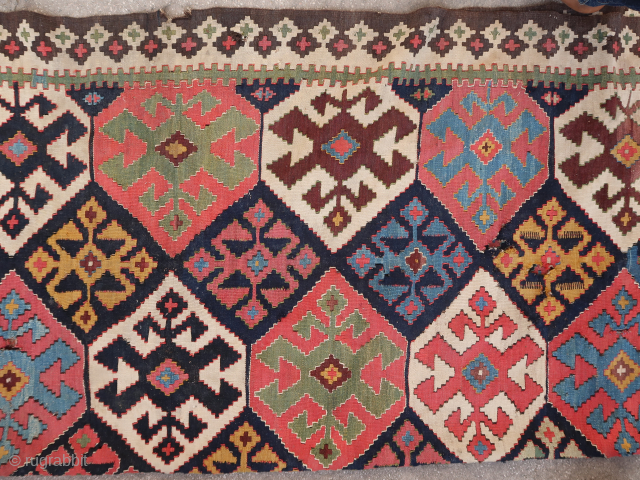 Old, rare, and colorful complete persian Kilim for a resto project (284 cm. x 177 cm.) Extraordinary dyes and playful visual schema. In need of a skillful restorer + a good collector's  ...