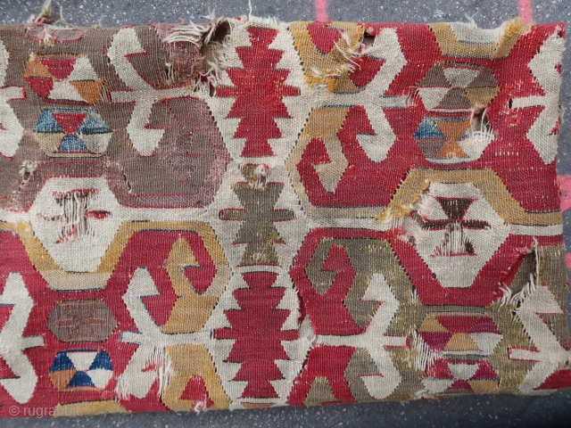 Rare and early anatolian kilim frag (180 cm. x 155 cm)
A related piece considered as reflecting ancient imagery in the Caroline & H. M. MCCoy Jones Collection Anatolian kilim book plate 35.  ...