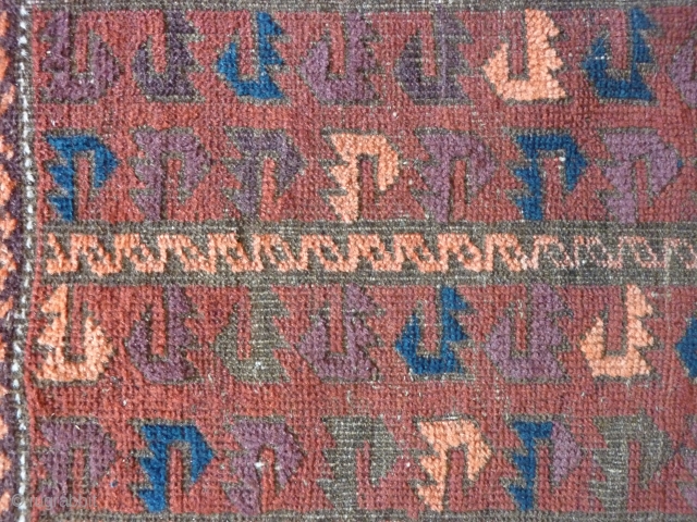 Old Baluch rug of a rare type. 
Complete with skirts. Damages to the selvedges and some wear in the field. Extraordinary complex border and appealing field including some aubergine color.
144cm x 85cm

 