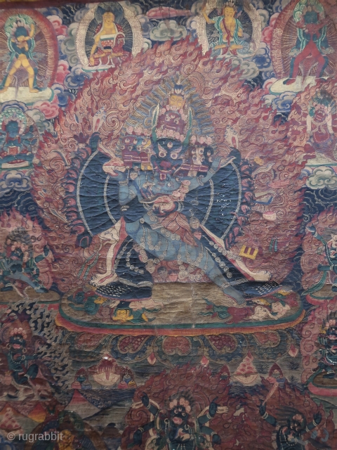 Antique, tibetan or nepalese Thangka painting, of the deity Mahottara Heruka in consort with Krodheshvari, central figure of the seven tiered, wearing a tiger's skin, trampling multiple figures under each foot, with  ...