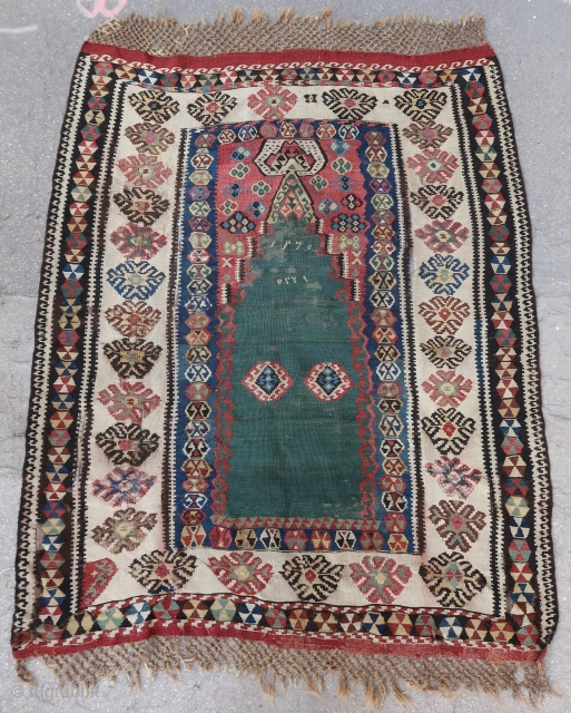 Rare and antique North East anatolian prayer kilim (175 cm. x 130 cm. with braided ends 160 cm. x 130 cm.  without)
Complete, but with several old repairs, slits and minor losses,  ...