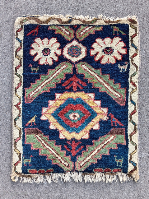 Rare, old and colorful, antique persian kurdish rug mat (58 cm. x 48 cm.)
High pile all over, Mina Khani design, rustical, with glowing abrashed colors.
Condition visible on pictures: damaged at ends, roughly ...