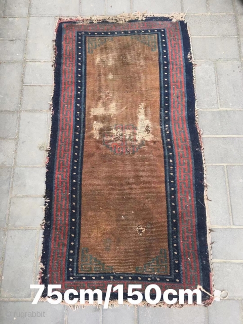Tibetan rug, brown background with single group flower pattern, it was produced in Mid qing dynasty. Wool warp and weft. Size 75*150cm(29*58”)           