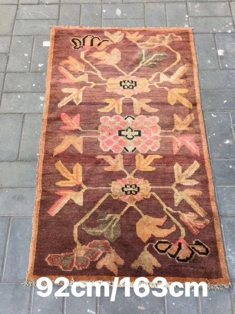 Tibetan rug, camel background with three flowers veins. Good age . Size 92*163cm(36*164”)                    