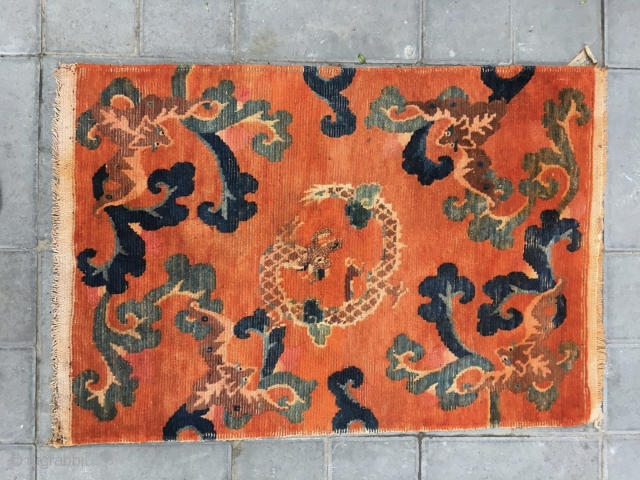 Tibetan rug, Orange background with bat pattern, surrounded by the bat veins. Very nice rug, good age and condition. Size 88*60cm(34*23”)            