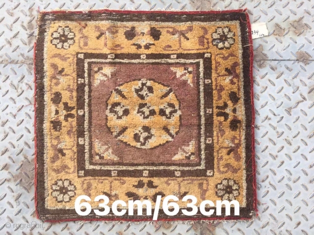 Chinese rug, it was produced in Gansu province. Very rare. Camel background with single group flower veins. Good age.size 63*63cm(25*25”)             