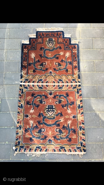 #2029 Baotou rug, it was produced in Baotou area in Inner Mongolia. A sit mat with back. Red background with lively dragon pattern, lucky cloud salvage. Good age and quality. Size 145*75cm(57*29") 