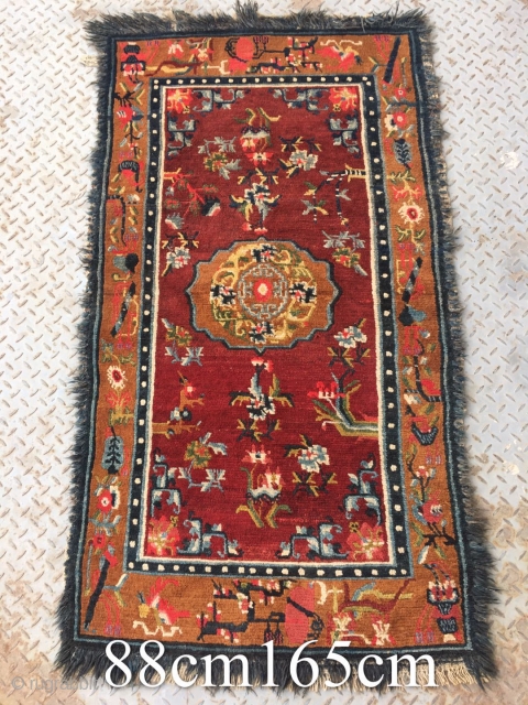 Tibetan rug, red background with colorful flower and grass pattern. Good age and condition. Size 165*88cm(64*34”)                 