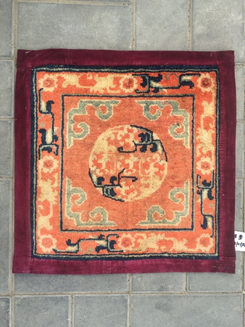 #2047 Baotou rug, lama sitting mat, orange background with single group flower veins, around  lucky cloud and with flower selvage. Good age and quality. Size 55*55cm(21*21")      
