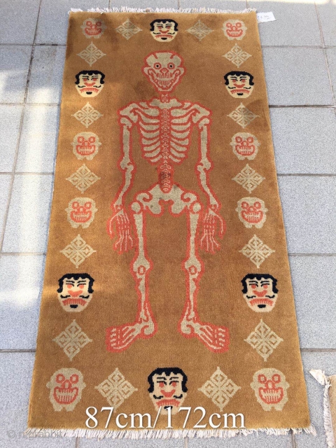 Fake Tibetan rug, light camel background with skeleton pattern. Good condition. Size 172*87cm(67*34”)                    