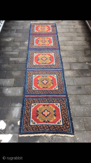 #2071 Tibet rug, five joined mat long rug, wool warp and weft. Coral red background with medallions flowers pattern. It used by lama pray in temple. Good age and quality, no any  ...