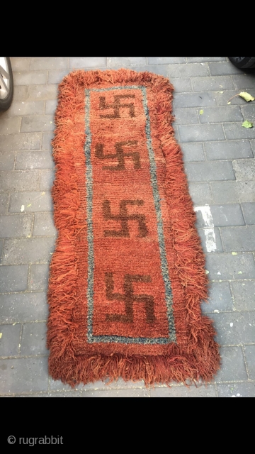 #2082 Tibet Wangden rug. Red background with 卐 buddha lucky sign. It is a pattern turning in clockwise, Buddhism thinks that clockwise direction turning is luck. The veins symbolizing permanent good fortune.  ...