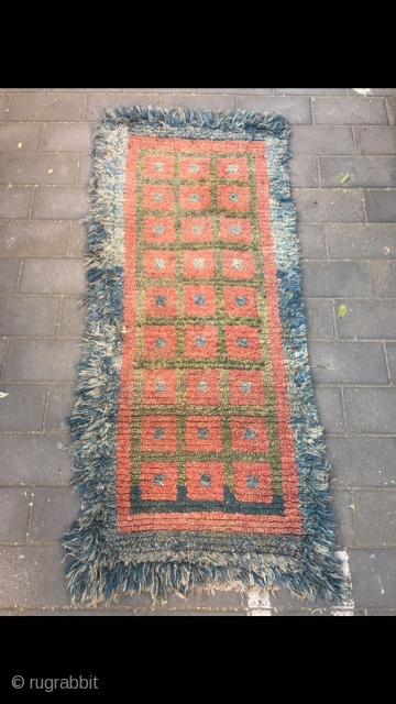 #2082 Tibet Wangden rug. Blue background with red and green selvage checker boards veins.good age and quality. Size 165*75cm(64*29")              