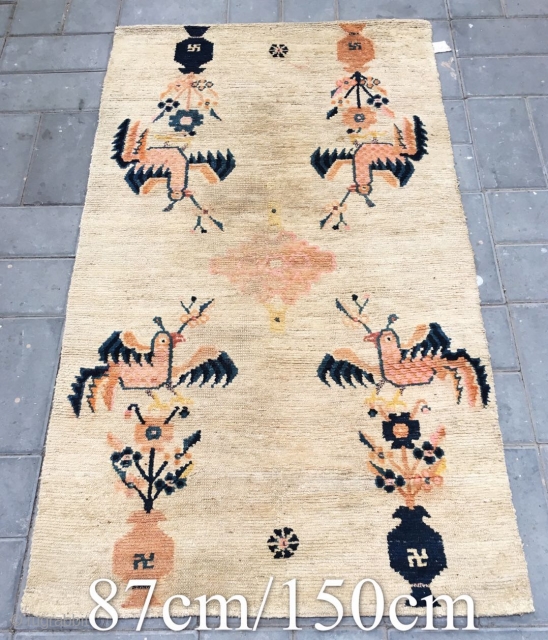 Tibet rug, The symmetrical pattern of golden chickens and vases and flowers is very interesting and rare. Good age and condition. Size 87*150cm(34*59”)          