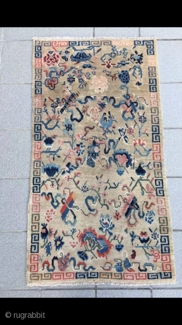 Tibet rug, light camel background with Buddha eight treasures pattern. Size 153*82cm(60*32”). Good age and condition.                 