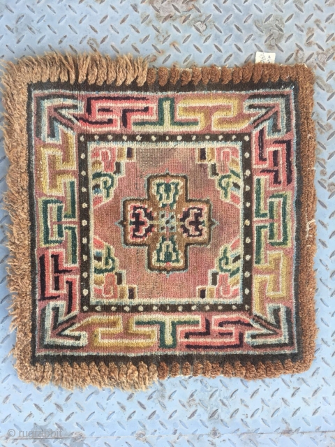 Tibetan square rug, single cross shape flower around lucky cloud veins. Very beautiful colorful and good quality. Wool warp and weft. Tightly row knots. Very good age. Size 68*68cm    
