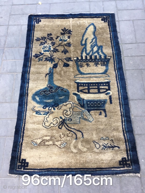 Chinese Baotou rug, light camel backs with antique Bogu veins, vase, Peony, Ruyi, bonsai as well as the text are allegorical spring, sunshine good luck. Good age and condition. Size 96*165cm(37*64”)  