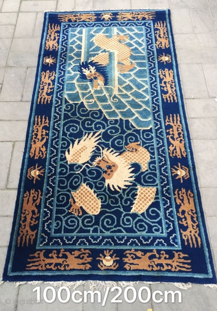 Chinese Baotou rug, blue background with nice dragon in the cloud pattern. Good condition. Size 100*200cm( 39*78”)                