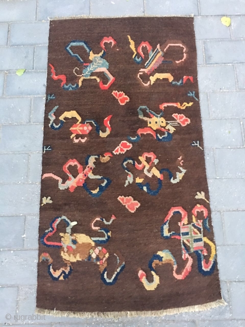 #2008 Tibet rug, it was produced about late Qing Dynasty. The brown background with eight Buddha lucky things. Which are eight kinds of treasures offered by the temples. They are the avatar  ...