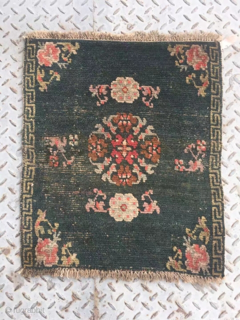 Tibet rug, very nice green color with single group flower pattern. Good age. Size 64*52cm(25*20”)                  