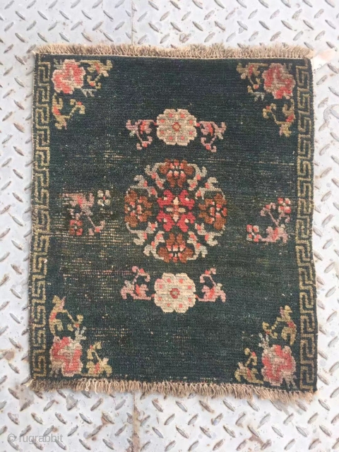 Tibet rug, very nice green color with single group flower pattern. Good age. Size 64*52cm(25*20”)                  