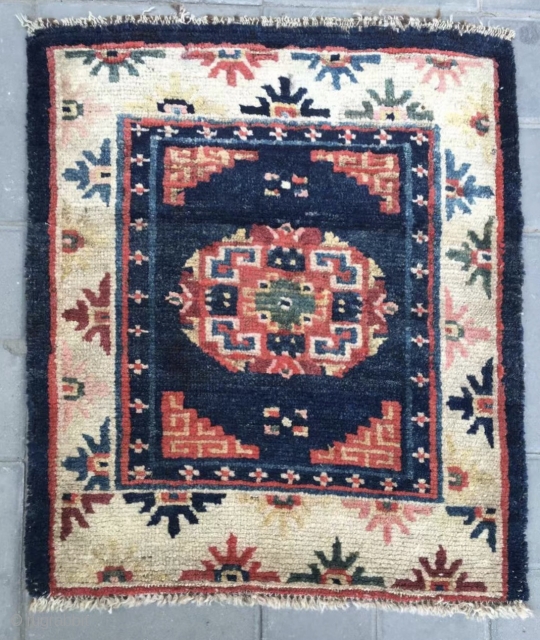 Tibet rug, blue background with nice flowers . Good age and condition. Wool warp and weft.size 63*75Cm(25*29”)                