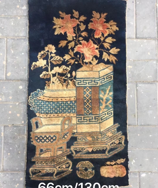 Chinese Baotou rug, blue background with Bogu vase and flowers vines. Good age and condition. Size 66*130cm(26*51”)                