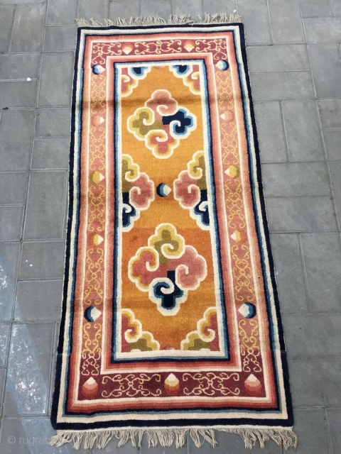 Ningxia rug, yellow-camel background with colorful lucky cloud pattern, around with lucky cloud selvage. Good age and condition. Size 161*76cm             