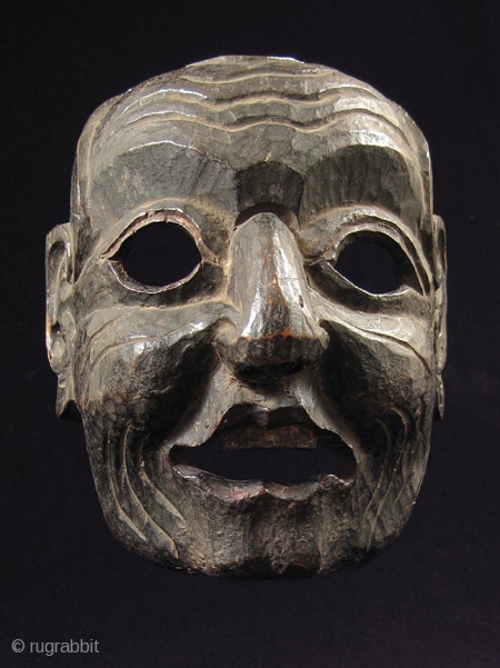 Wood mask, Nepal/Tibet.
8” high by 6.5” wide (20 by 16 cm) plus base.
Late 19th century
                  