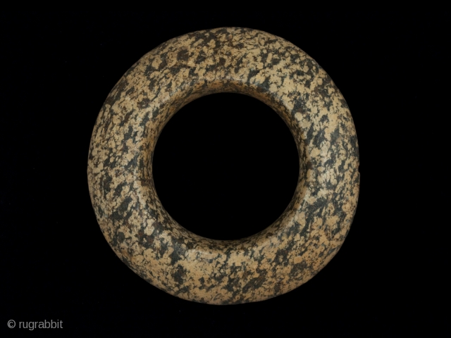 Stone Ring, Western Sahara, Africa.
4.25" (10.8 cm) diameter, 1" (2.5 cm) thick at center, 7" (18 cm) inner circumference, 315 grams
Neolithic Period, 2000 B.P. or earlier
No one really knows how these rings  ...