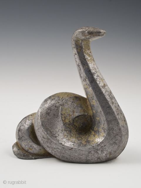 Snake okimono, Japan.
Cast aluminum, remnants of gilding or gold paint.
Mid 20th century.
4.5" (11.4 cm) high by 4" (10 cm) wide.

Last year, a small group of cast iron animals was found in a  ...