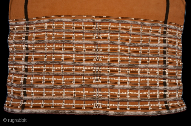 Skirt (Isikhakha or Umbhaco),
Xhosa or Mfengu peoples, South Africa.
Cotton, wool, glass beads, shell buttons, ochre pigment.
20th century.
61” (154.5 cm) long by 54” (137 cm) wide.

Isikhakha or umbhaco were typically made from a  ...