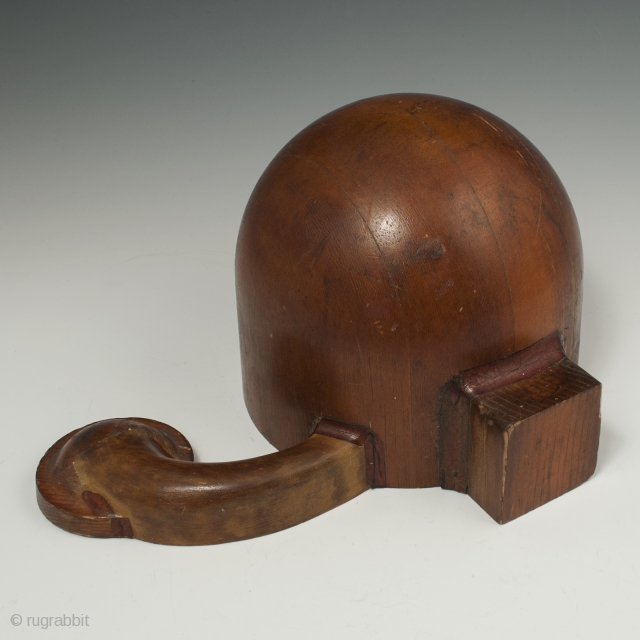 A very curious wood mold, possibly for a hat. The appendage is a mystery, as well as whether there was a second, slightly asymmetrical appendage on the other side at one time.  ...