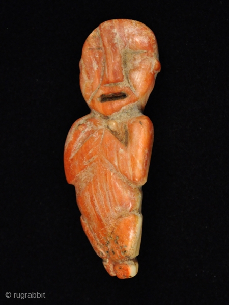 Figurine.
Inca.
Spondylus shell.
2-3/4" (7 cm) high.
A.D. 1350-1450.                           