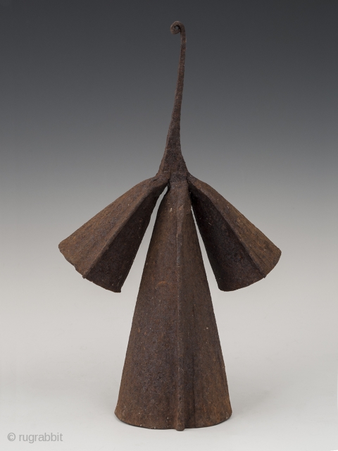 Gong currency,
Yoruba people, Nigeria.
Hand forged iron,
11" (28 cm) high and 6.75" (17 cm) wide,
Early to mid 20th century,
Very graceful anthropomorphic gong currency has two different pitches when struck.     