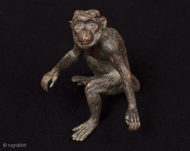 A very expressive small iron monkey.
Origin unknown.
3" (7.5 cm) high.                       