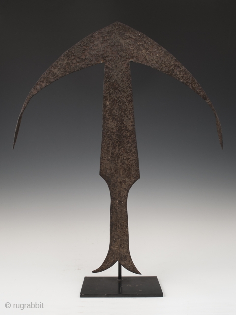 Anchor currency, zong,
Kwele people, Gabon/Democratic Republic of Congo.
Hand forged iron,
21.75" (55.3 cm) high as based and 16" (40.6 cm) wide.
Early to mid 20th century.

Inspired by a crossbow and mandjong, these anchor-like currencies  ...