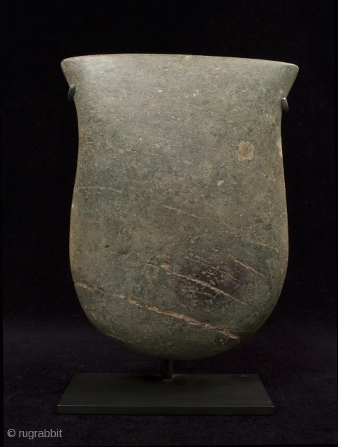 Ceremonial axe blade.
Valdivia culture, Ecuador.
Green stone.
9.5" (24 cm) high by 7.5" (19 cm) wide by 1.5" (4 cm) thick.
3000-2500 B.C.
Provenance: Private New York collection         