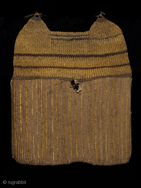 Armor vest or cuirass
Tin (Western Dani) or Kabasi (Moni), Baliem Valley, West Papua
Orchid fiber (Dendrobiinae), rattan fiber, bird feathers
20" (51 cm) high
Early to mid-20th century
Ex. Old Dutch collection formed in the 1960s

This  ...