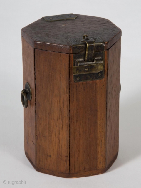 A small, unique octagonal box from Korea. 4.75" (12 cm) high by 3" (7.5 cm) wide. It opens by sliding the latch to the left, which releases the small hook. Brass hardware,  ...