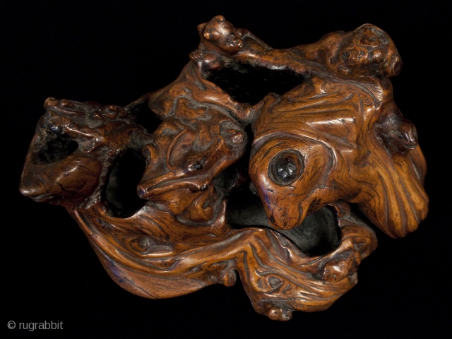 Burl okimono,
Japan.
Burl wood, paint.
9" (23 cm) wide.
Meiji Period.
This fascinating burl figure is full of whimsical animals: monkeys, alligator, frog and maybe a squirrel. Dots of black paint highlight the eyes of the  ...