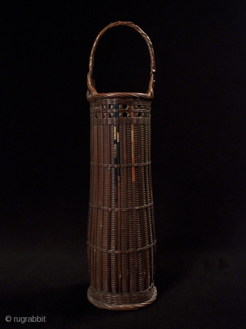 Ikebana basket,
Japan,
Bamboo, split arrows,
22" (56 cm) high,
Taisho Period,
Chikunsai III, b.1940, was known for using split arrows in his baskets, as can be seen in the painted bamboo. He is the grandson of  ...